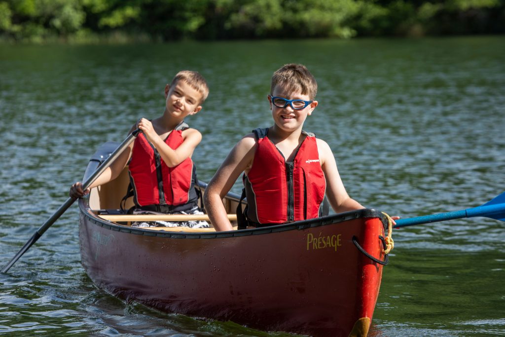Campers in canoe on the lake
