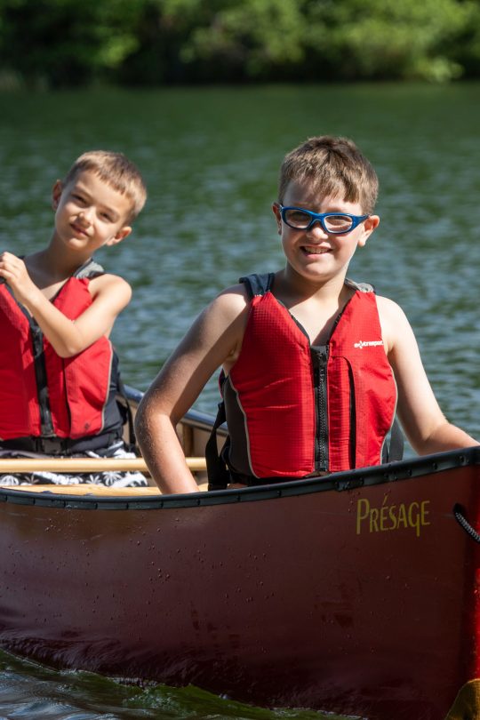 Campers in canoe on the lake