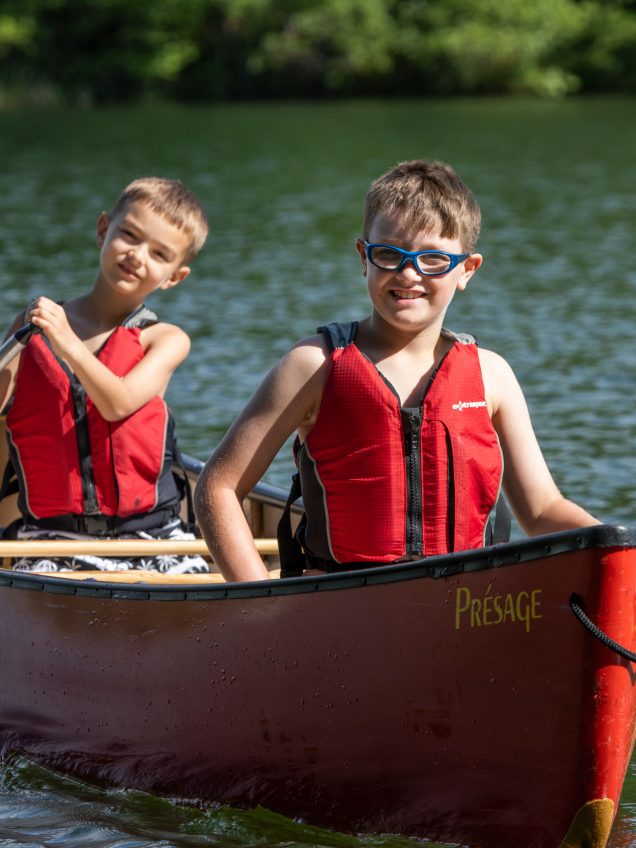 Campers in canoe on the lake