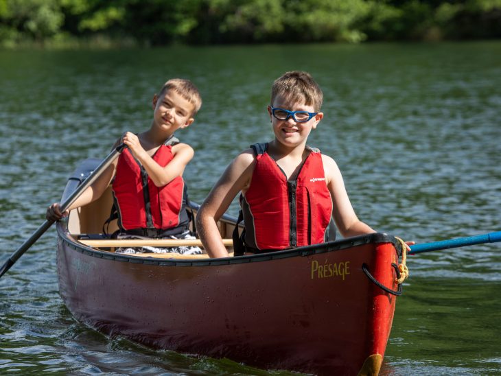 Campers in canoe on the lake