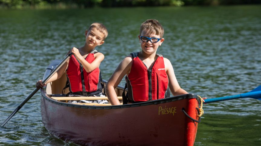 Campers in canoe on the lake